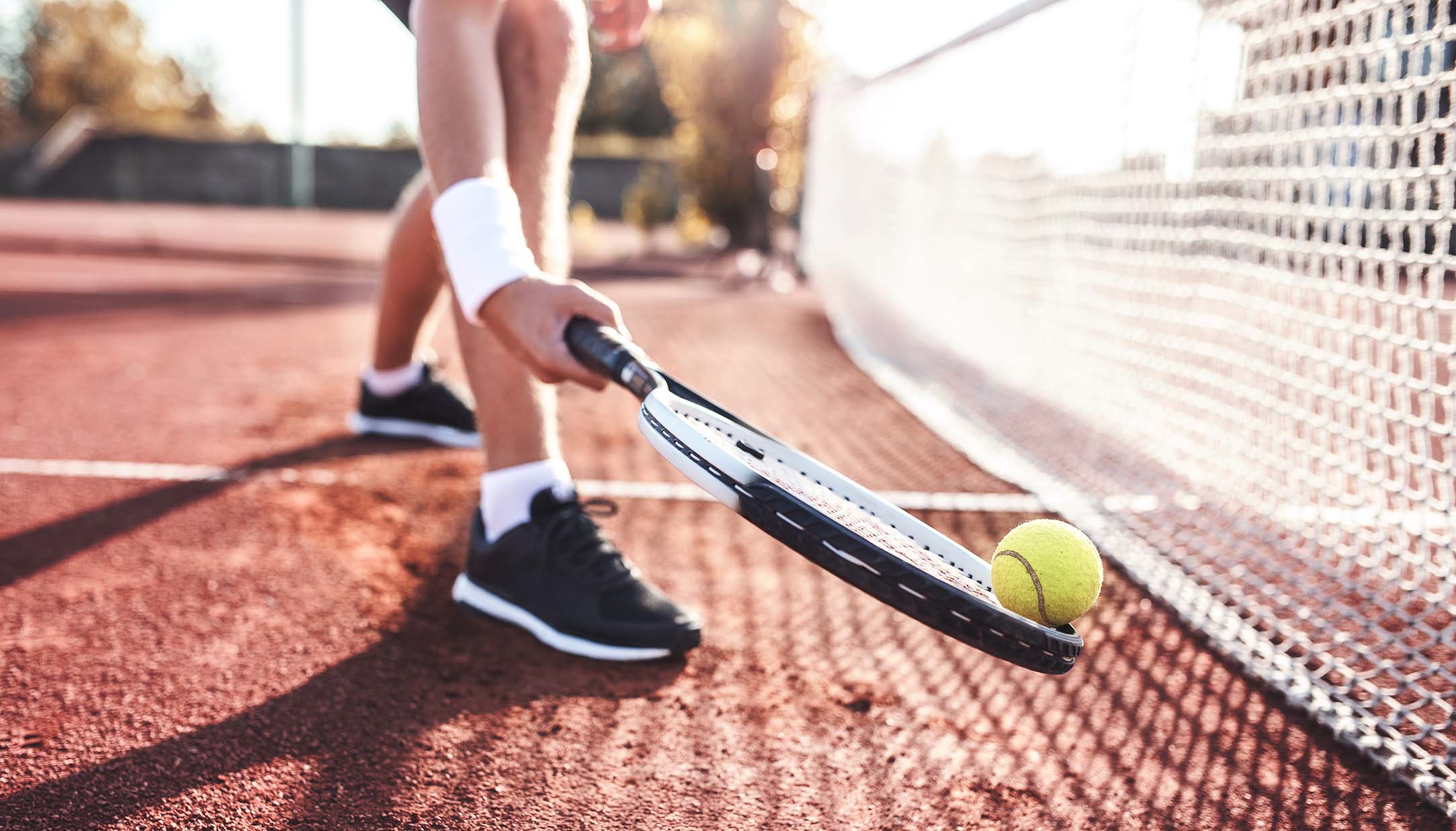 Tennis. Young man playing tennis, close up photo. Sport, recreation concept